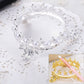 Silver-tone crown novelty pen holder with white pearl beads and curved filigree base
