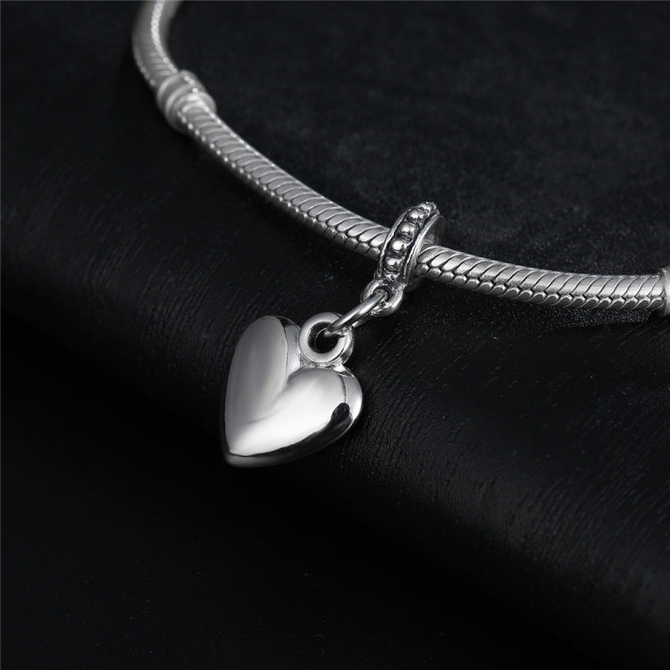 Silver heart charm bead pendant attached to a silver tone chain