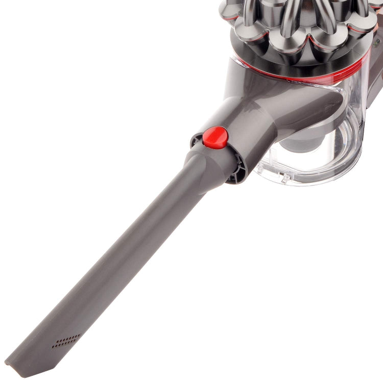 Gray crevice tool attachment with red button, vented side panel