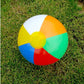 Multicolor inflatable beach ball water toy with central yellow hub, close-up.