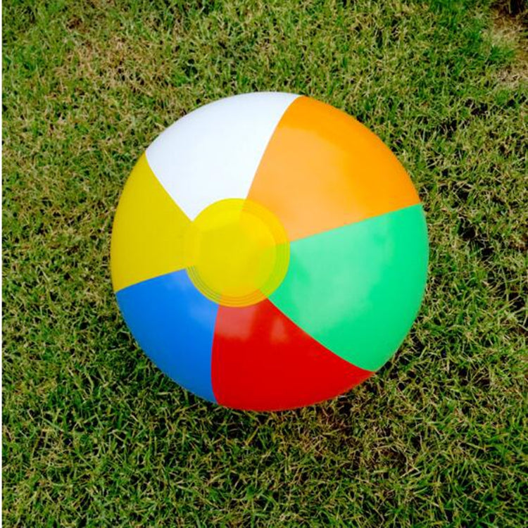 Multicolor inflatable beach ball water toy with central yellow hub, close-up.
