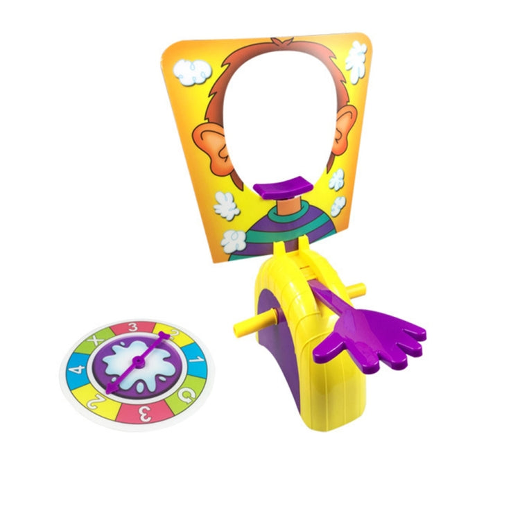 Pie face prank game toy with yellow figure and purple launcher, plus countdown spinner wheel