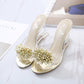 Gold rhinestone slide wedge mules with clear heel and open-toe strap