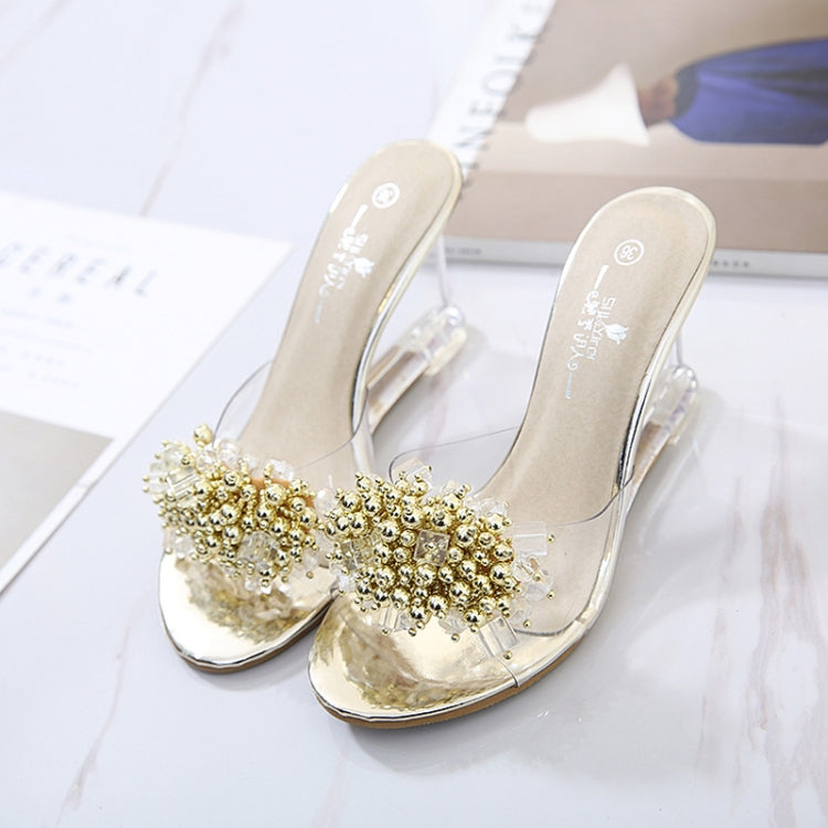 Gold rhinestone slide wedge mules with clear heel and open-toe strap