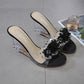 Black rhinestone open-toe wedge mules with clear block heel and jeweled strap
