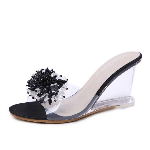 Rhinestone wedge heel slide sandal with black bead clusters and clear block heel