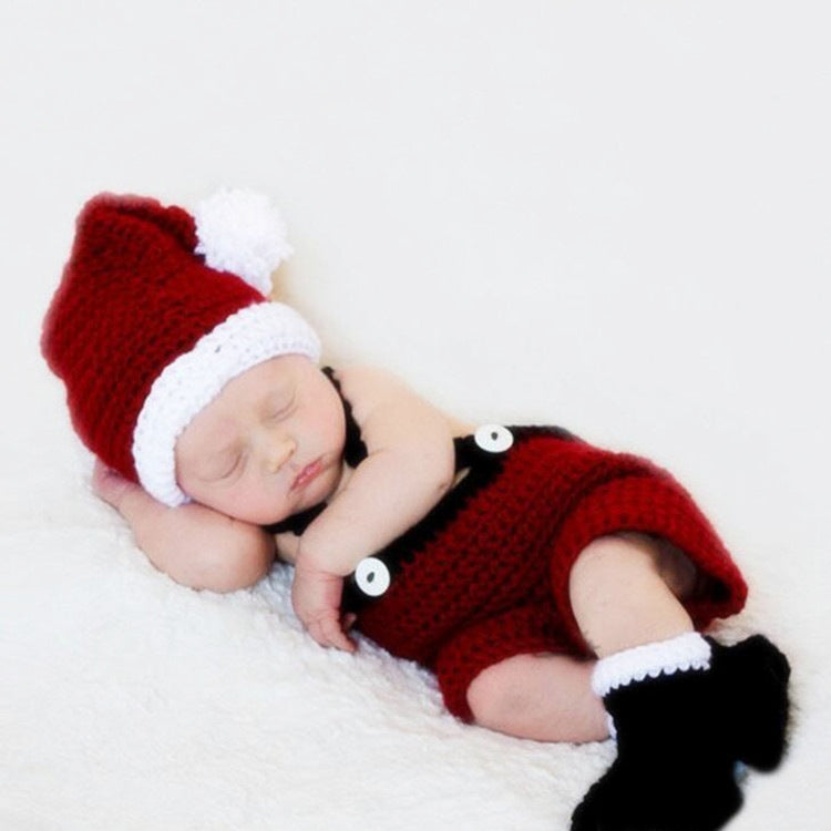 Knit baby Christmas outfit set with red pom-pom hat, red romper, and white-trim socks