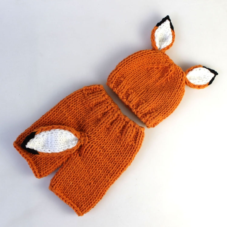 Orange wool knit hat and pants with fox face patches and pointed ear tops