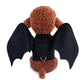 Front view bat wings pet costume: brown plush dog wearing black harness and wings