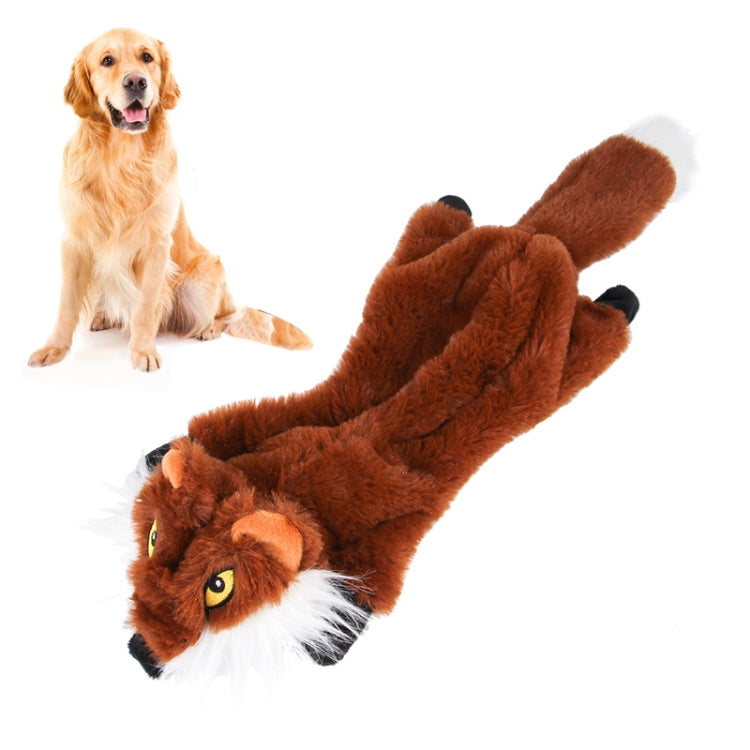 Dog plush bite toy in brown fox style with white muzzle, shown with a sitting dog