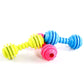 Multi-color TPR bite-resistant dumbbell dog toys laid out: yellow, blue, and pink