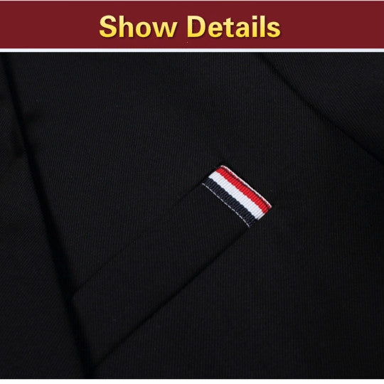 Black blazer fabric close-up with stitched pocket edge and red-white striped tag