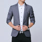 Men's gray blazer with front button closure, white button-up, red pocket square