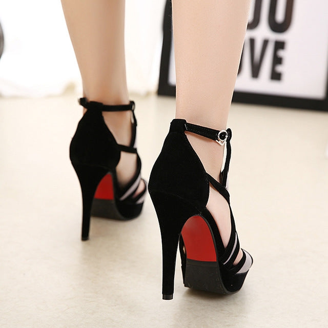 Black high-heel fish sandals with thin straps and red-studded heel