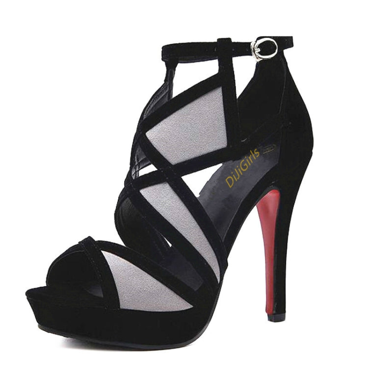 Side view of black high-heel fish sandals with ankle strap and geometric panels