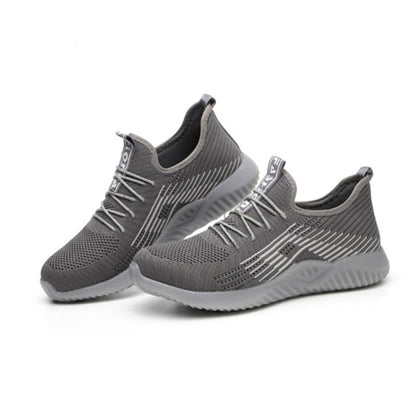 Grey men’s work sneakers with elastic knit upper, lace-up design, and cushioned sole