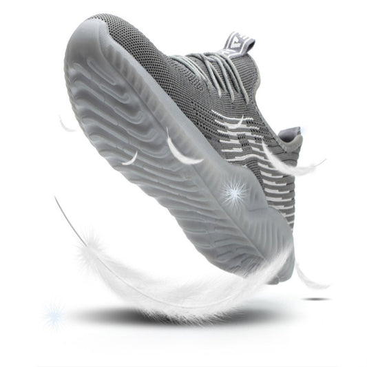 Grey lace-up work shoe with side view of treaded sole and knit paneling