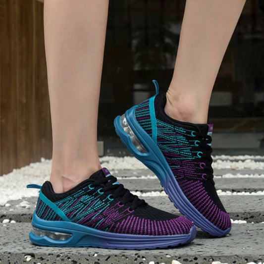 Side view of women’s lace-up mesh sneakers in black, purple, and teal with air sole
