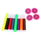 Colorful paint pens with caps and four pink stamp discs with dot patterns
