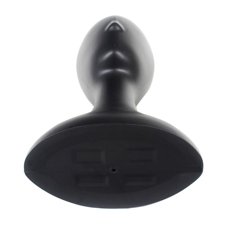 Black plastic mannequin head display stand, rear view with smooth back panel
