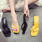 Women’s pin-toe stiletto heeled sandals in black and yellow with open toe straps