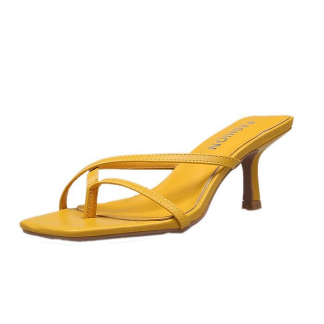 Yellow pin-toe stiletto heeled sandals with two slim thong straps