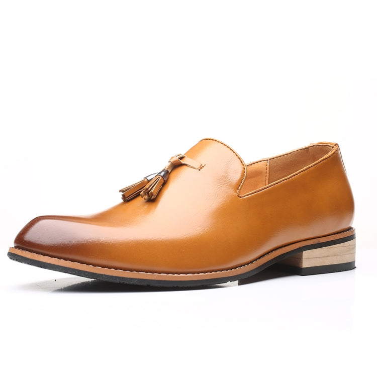 Men's pointed slip-on dress shoe in tan, tassel accent and side strap detail