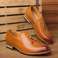 Pair of men's tan pointed dress shoes with tassel fringe and side strap