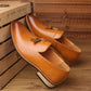 Men's tan pointed slip-on dress shoes, tassel detail, cushioned-looking insole