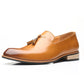 Men's pointed slip-on dress shoe, tan upper and tassel detail, low stacked heel