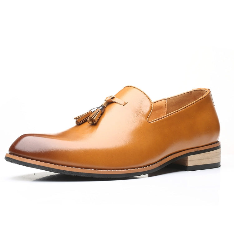Tan pointed loafer dress shoe with tassel detail, soft rubber sole, angled side view