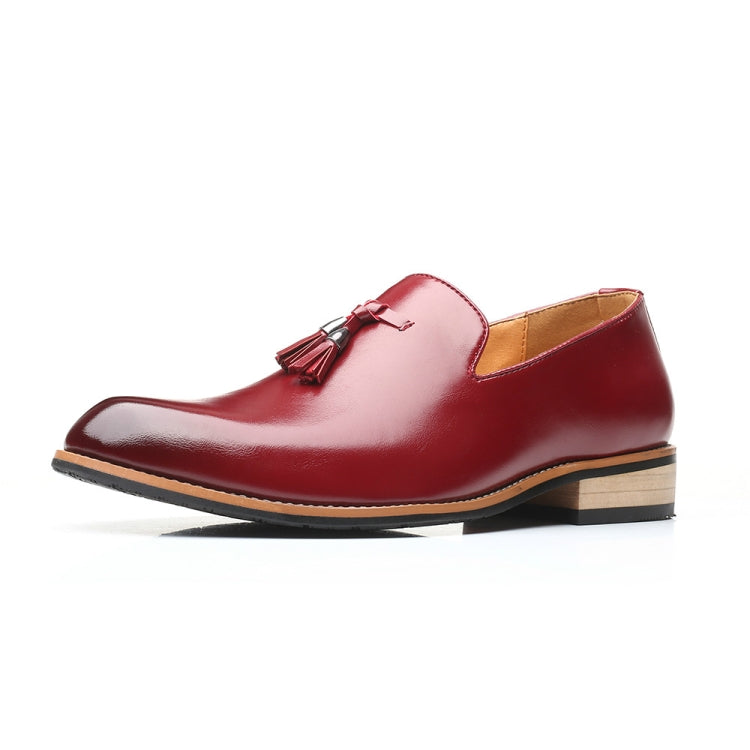 Red men’s pointed loafer-style dress shoe with tassel detail and rubber outsole