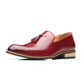 Red men’s pointed dress shoe, tassel front, tan insole lining, rubber sole