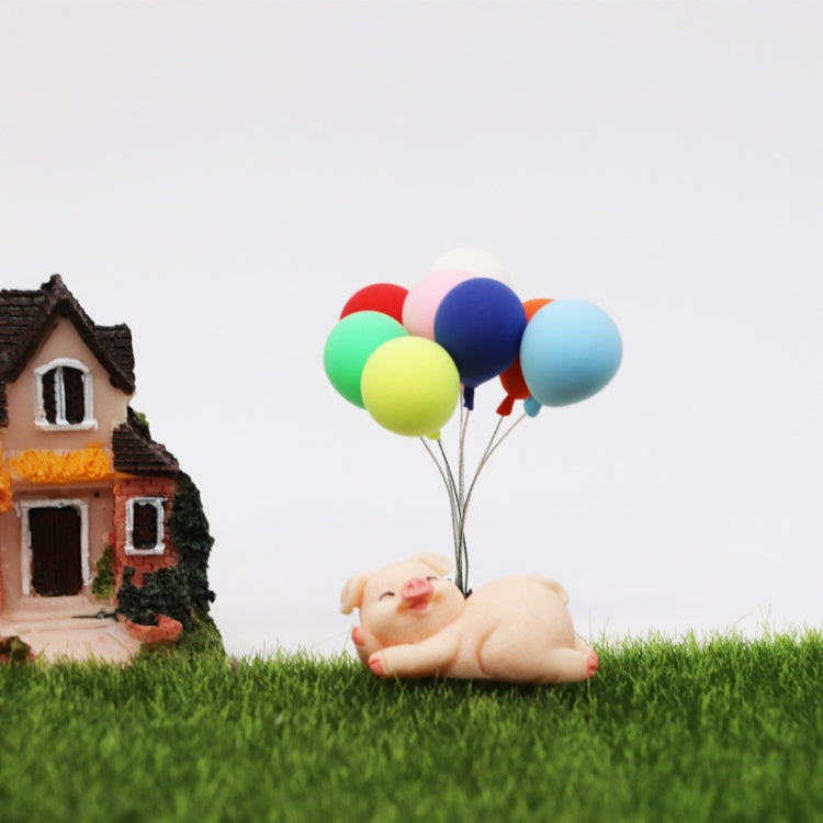 Mini balloon bouquet of 8 colorful balloons on wire stems for garden decoration