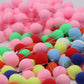 Close-up of assorted mini balloon decorations with many pink, red, green, and blue balloons