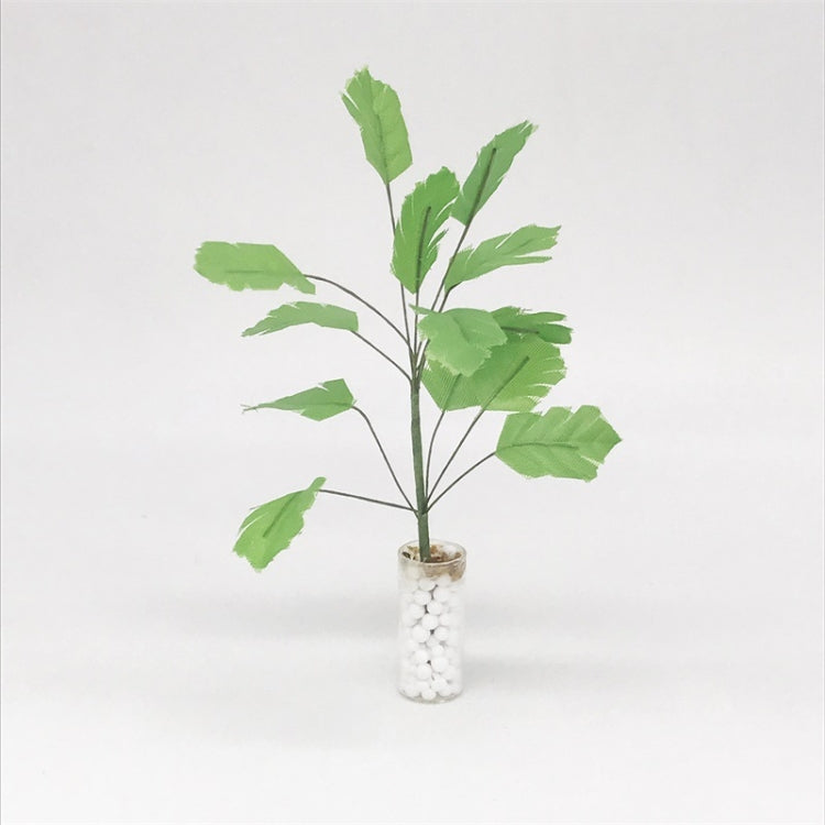 Mini dollhouse banana tree plant with green leaves in white pebble vase