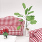 Mini dollhouse banana tree plant with green leaves and white pebble vase