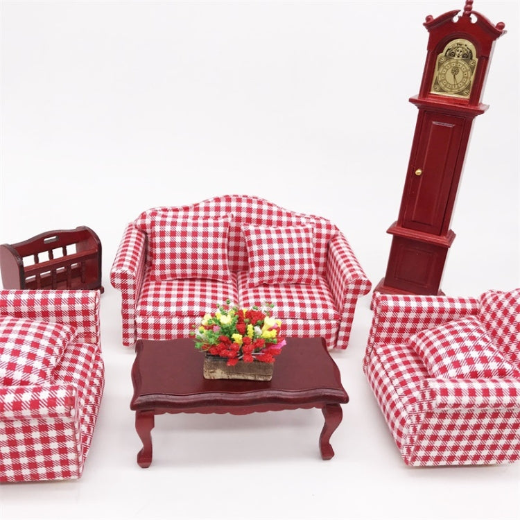 Mini clay flower planter on table in dollhouse living room, with red checkered seating