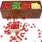 Miniature fruit apples in a wooden tray with compartments and loose pieces below.