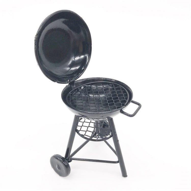 Mini round outdoor oven toy with open lid and wire grill grate, black metal