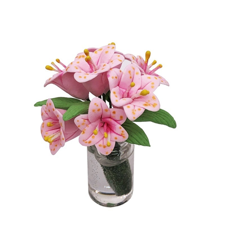 Mini dollhouse lily bouquet in clear glass vase with green leaves and pink flowers