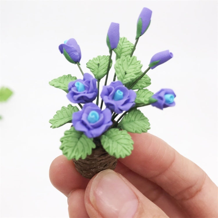 Handheld purple rose flower model toy with green leaves in brown pot