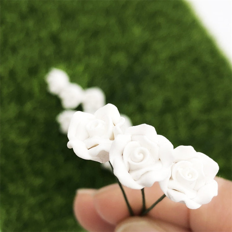 Close-up of white mini roses with green stems