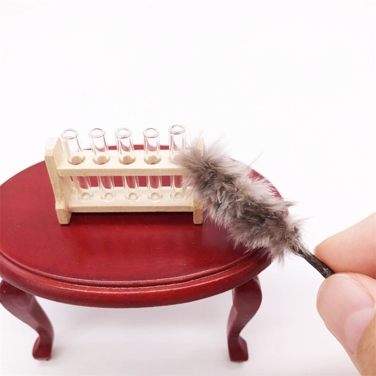 Mini chicken-hair simulation brush toy held near a red mini vanity with clear bottles