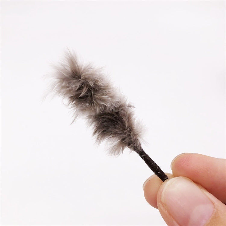 Mini chicken-hair simulation brush toy close-up with gray fuzzy head and dark handle