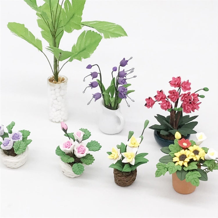 Assorted mini potted flower ornaments, including pink-and-white rose pots with green leaves