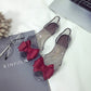 Transparent flat jelly shoes featuring a dark red bow detail and open toe
