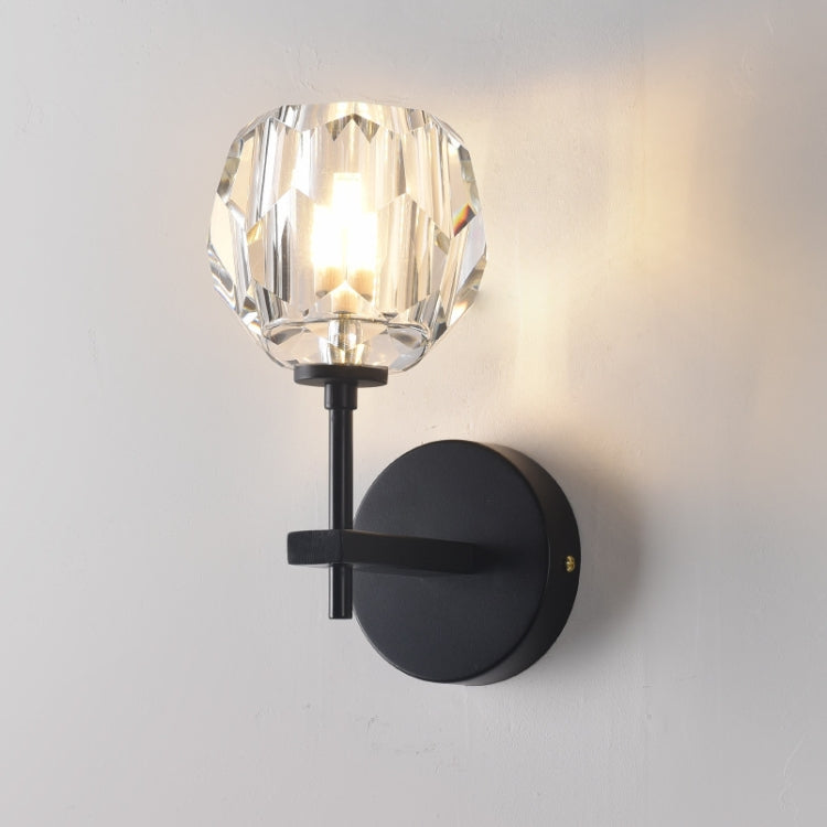 Black crystal wall sconce with faceted glass globe shade and round backplate