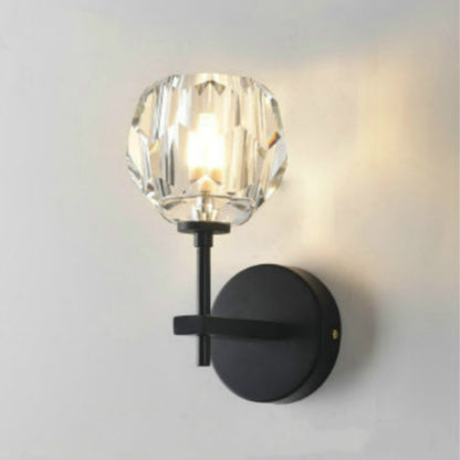 Black wall lamp with faceted crystal shade and round wall plate