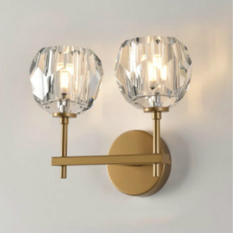 Gold double wall lamp with two faceted crystal shades and round backplate